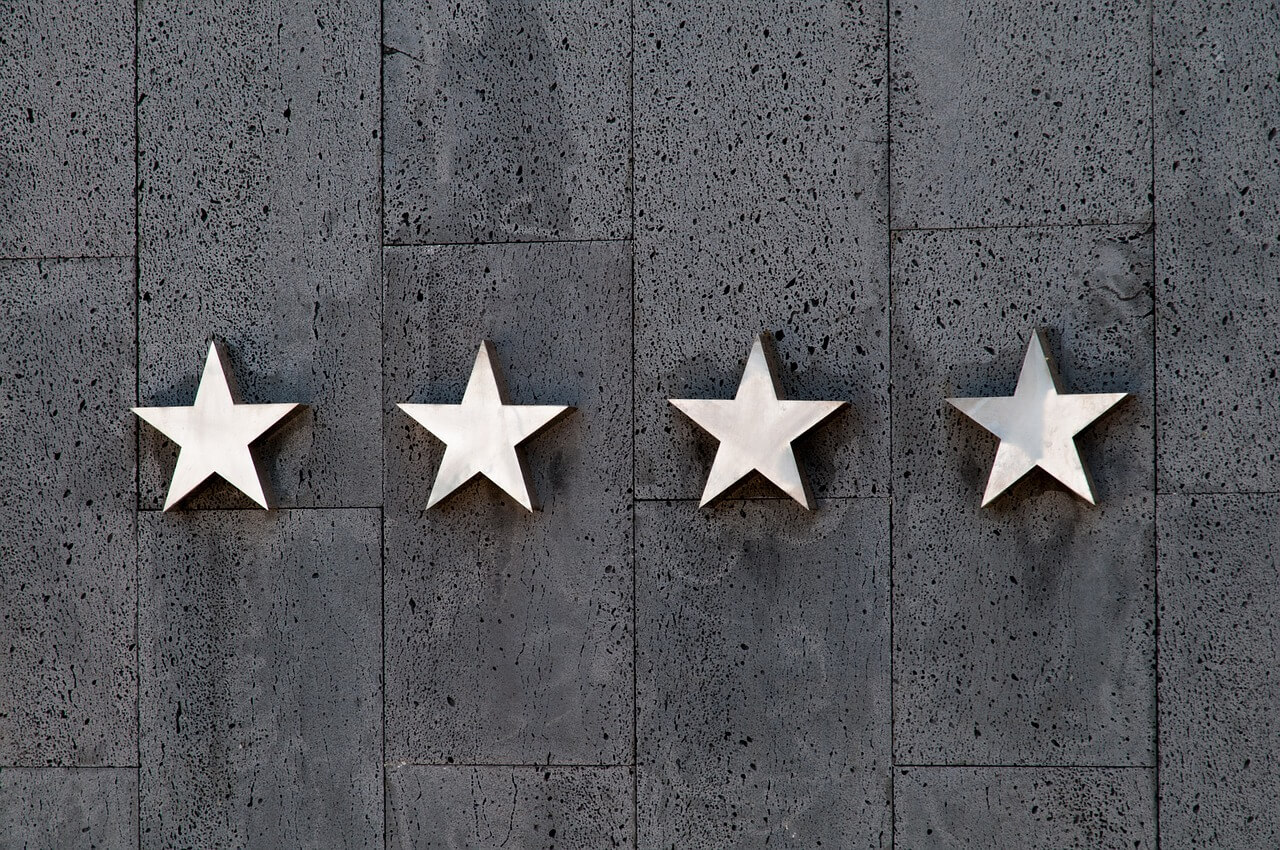 An image showing 4 silver stars on the wall