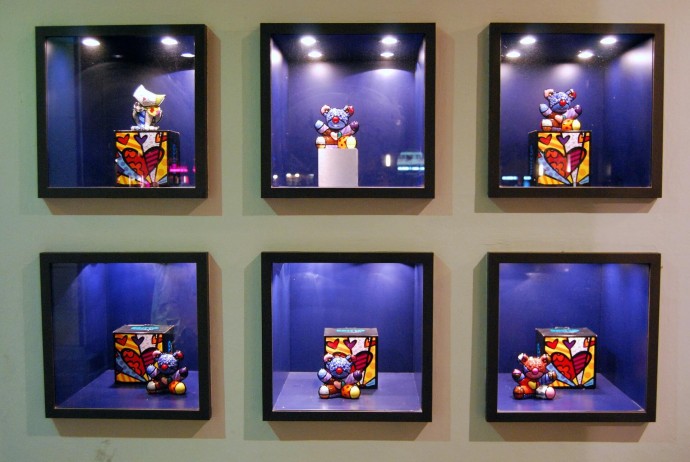 Toys displayed in glass cases.