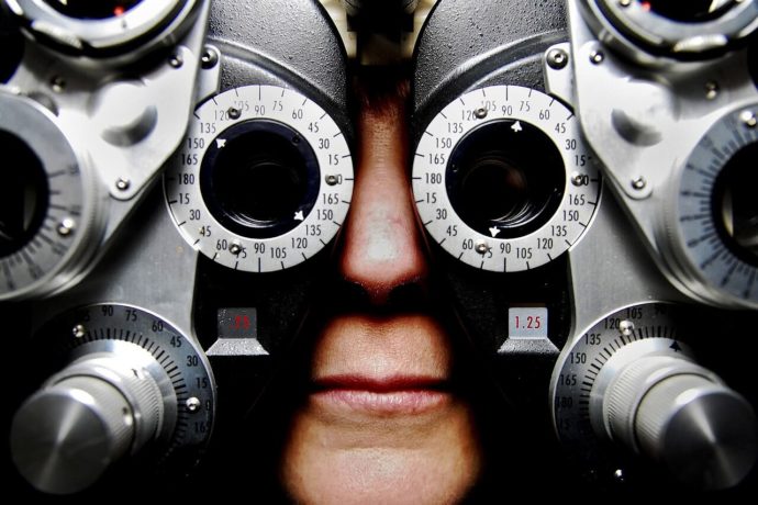 A person undertaking an eye exam.